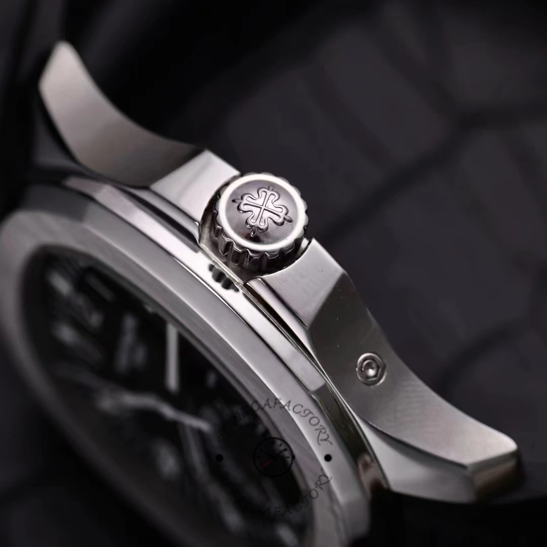 Detailed crown and case profile of the Patek Philippe Aquanaut 5164A-001 with polished edges.