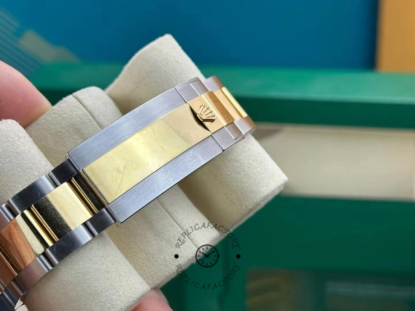 Rolex Sea-Dweller 126603 0001, bracelet clasp close-up, two-tone brushed finish.