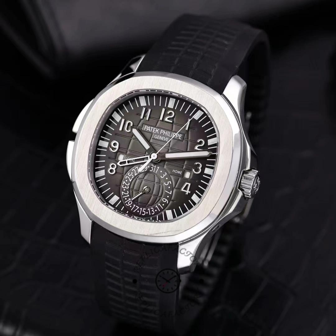 Dark background close-up of the Patek Philippe Aquanaut 5164A-001 dial, dual time display emphasized.