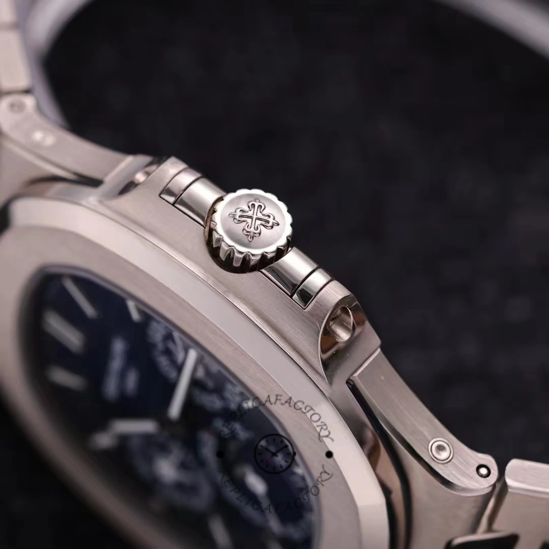 Crown-side close-up of the Patek Philippe Nautilus 5740 1G 001 showing the signed crown and case edge.