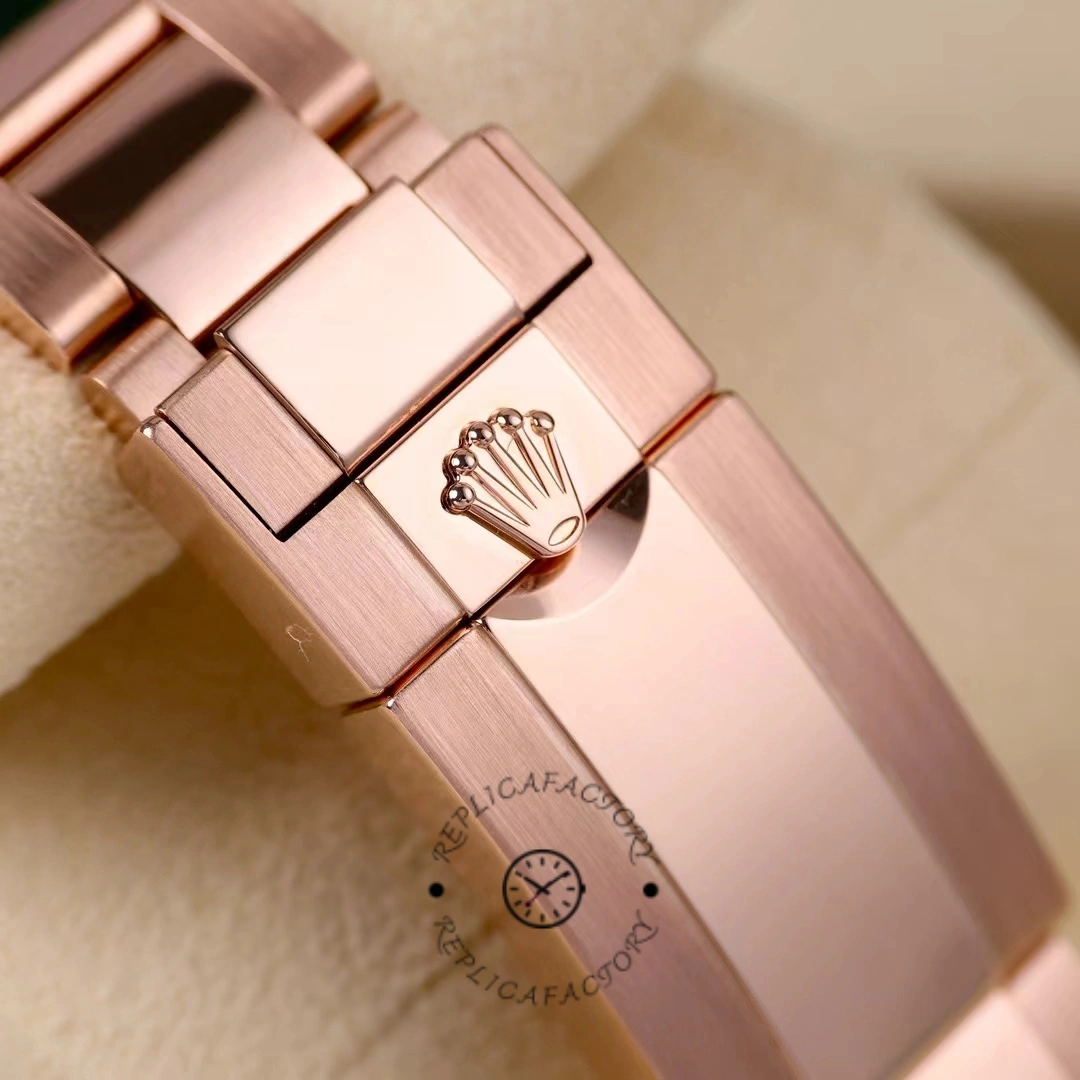 Clasp close-up of Rolex GMT-Master II 126715CHNR Everose bracelet with Rolex coronet logo.