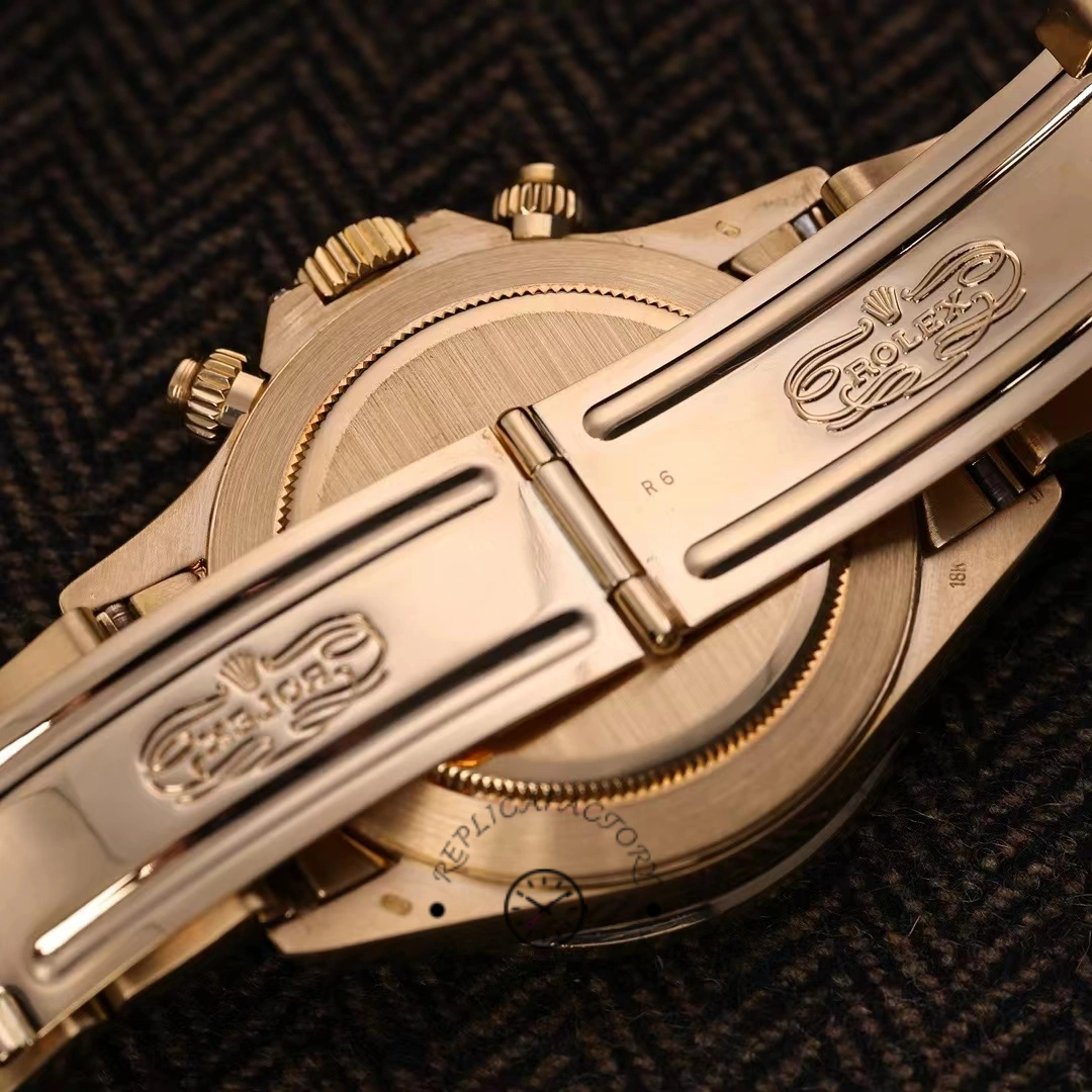 Clasp close-up of Rolex Daytona 116528 showing folding clasp engraving detail.