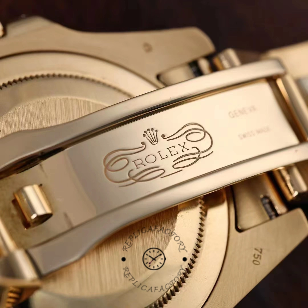 Rolex GMT-Master II 116758 clasp close-up, yellow gold Oyster clasp with engraving detail.