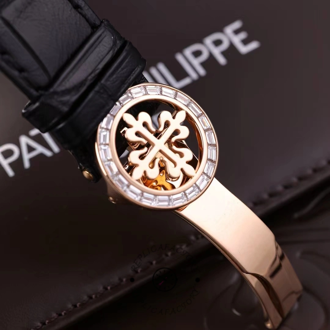 Clasp detail of Patek Philippe 6104R 001 showing engraved Patek Philippe Calatrava cross.