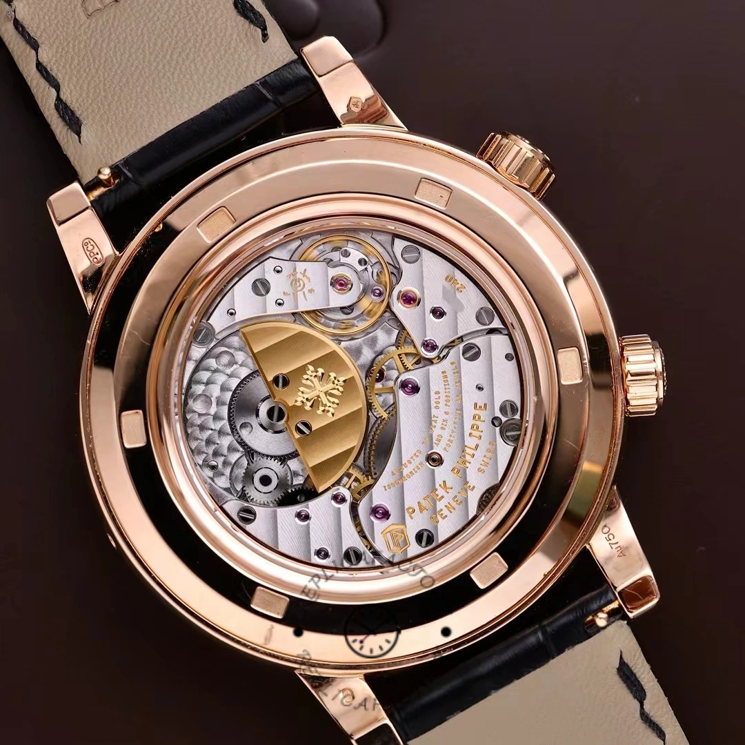Display caseback of Patek Philippe 6104R 001 highlighting movement bridges and gold rotor.
