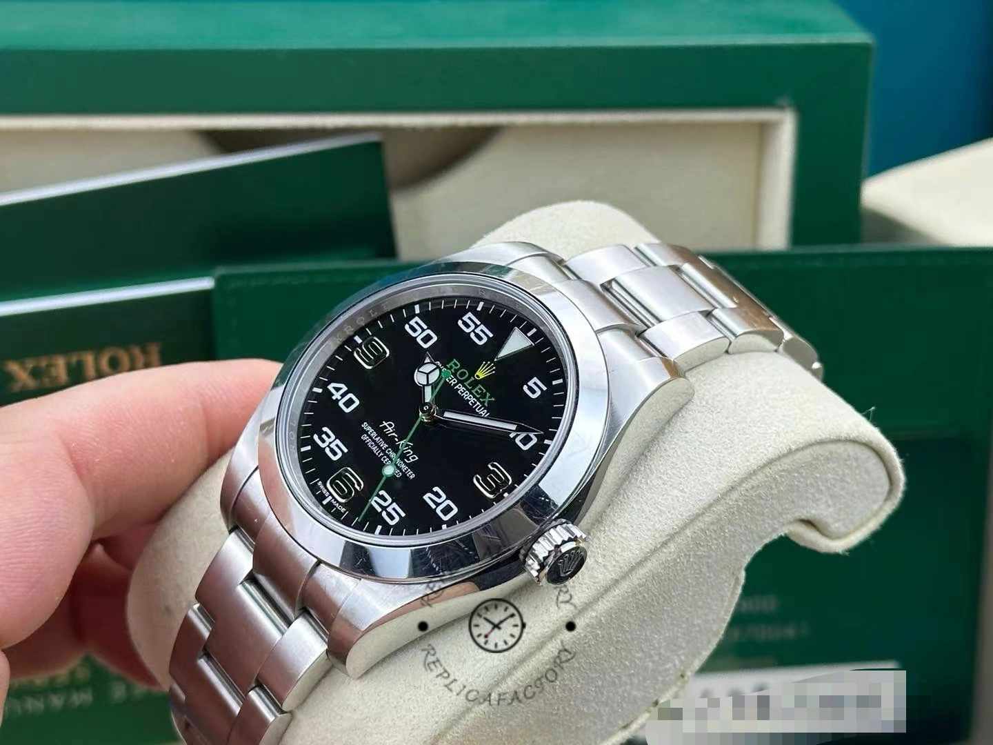 Rolex Air-King 116900, angled dial close-up showing luminous markers and seconds hand.