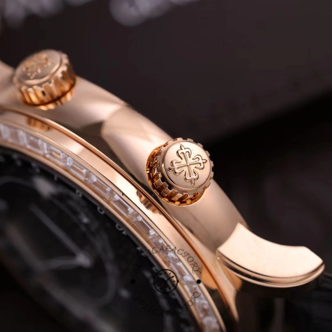 Close side view of Patek Philippe 6104R 001 showing signed crown and rose gold case flank.