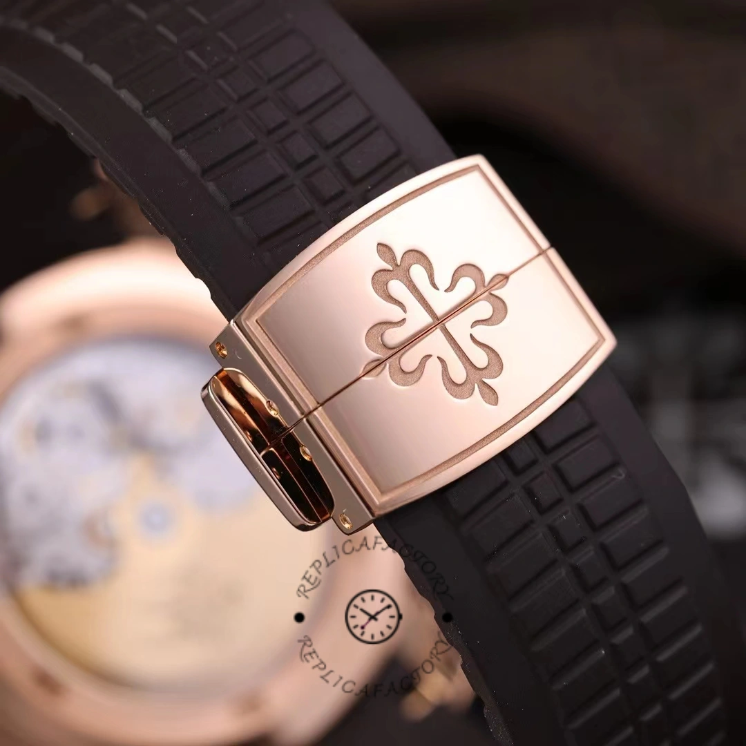 Strap keeper close-up of the Patek Philippe Aquanaut 5164R-001 showing the Aquanaut cross emblem.