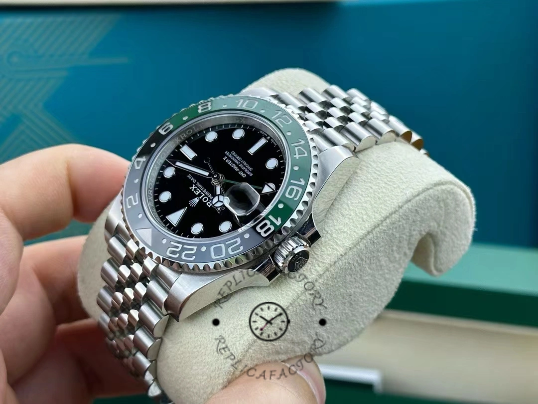Close front view of the Rolex GMT-Master II 126720VTNR in hand, black dial and bezel.