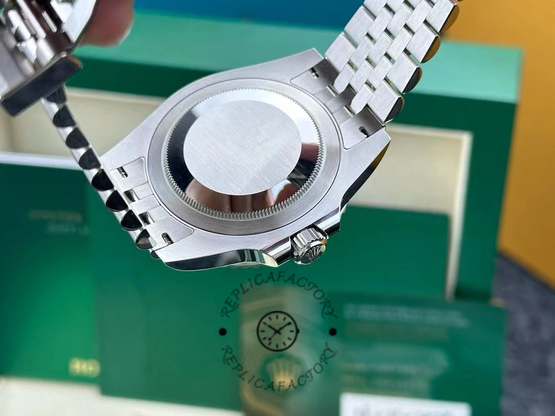 Caseback view of the Rolex GMT-Master II 126720VTNR with green box behind the watch.