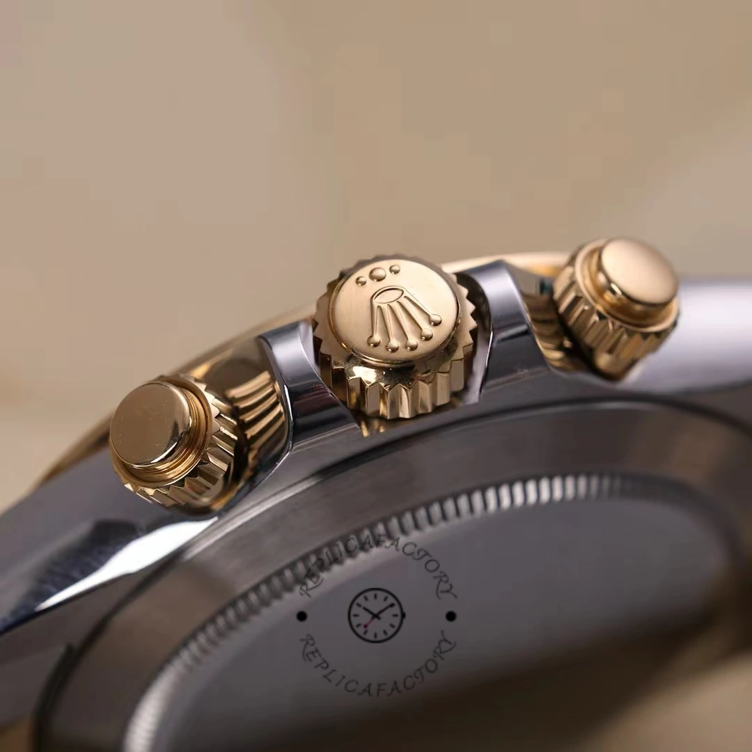 Rolex Daytona 116503 side close-up, yellow gold crown and chronograph pushers.