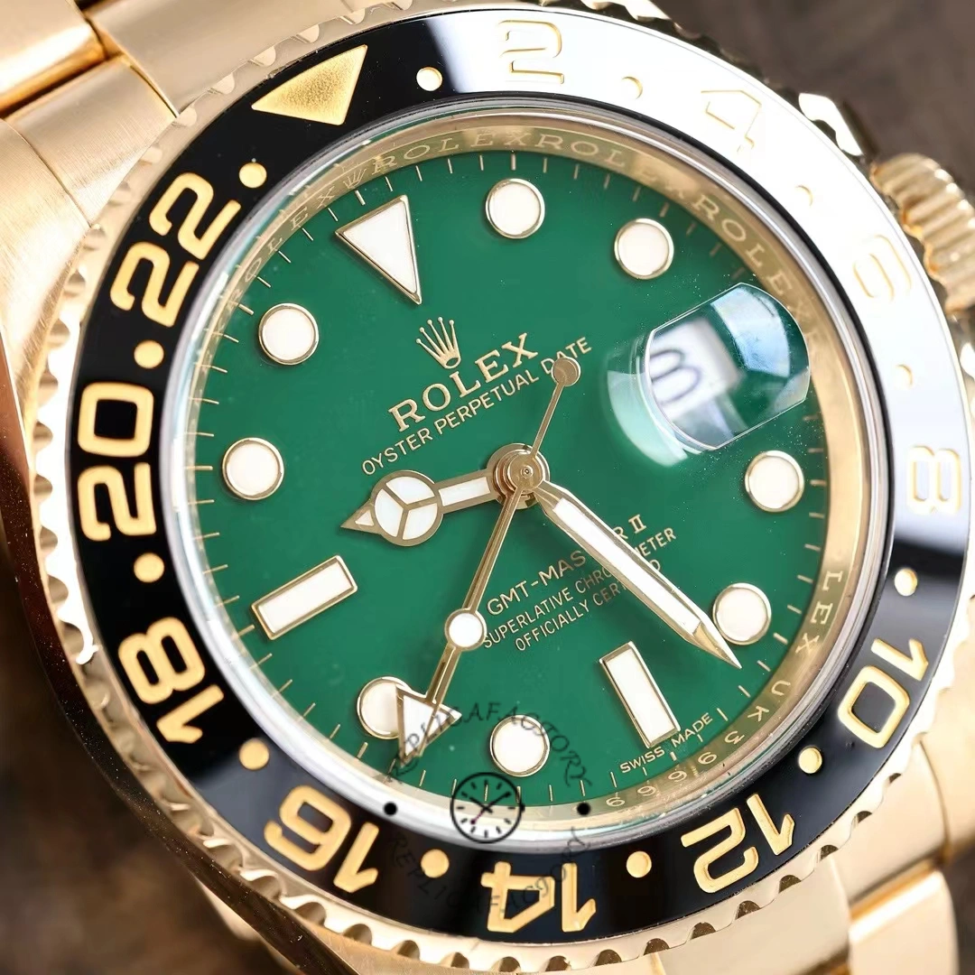 Rolex GMT-Master II 116718LN, dial close-up showing green sunburst finish and cyclops date.