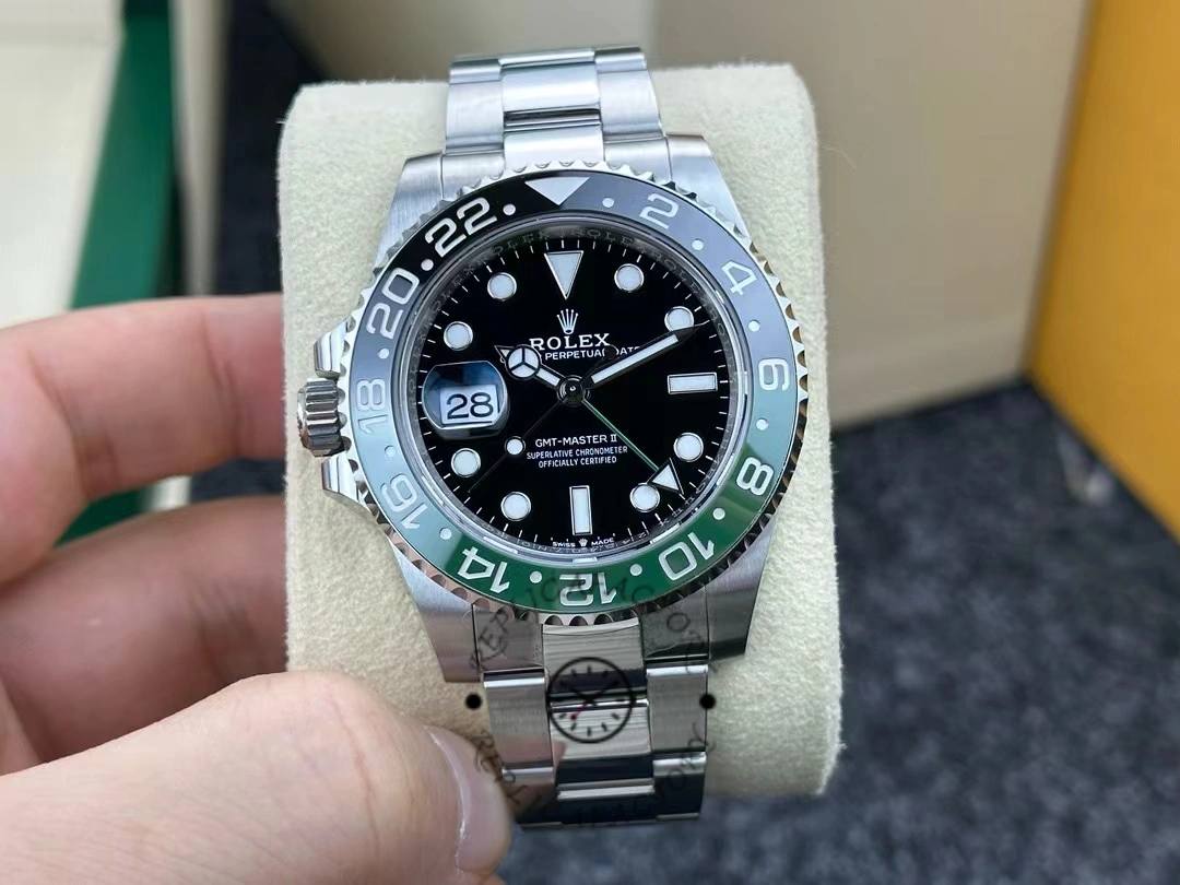Hand-held front view of Rolex GMT-Master II 126720VTNR showing dial and bezel.