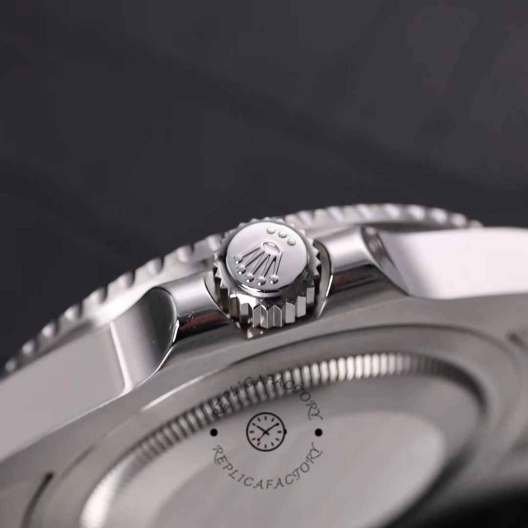 Rolex GMT-Master II 116710LN, side profile close-up showing crown and bezel edge.