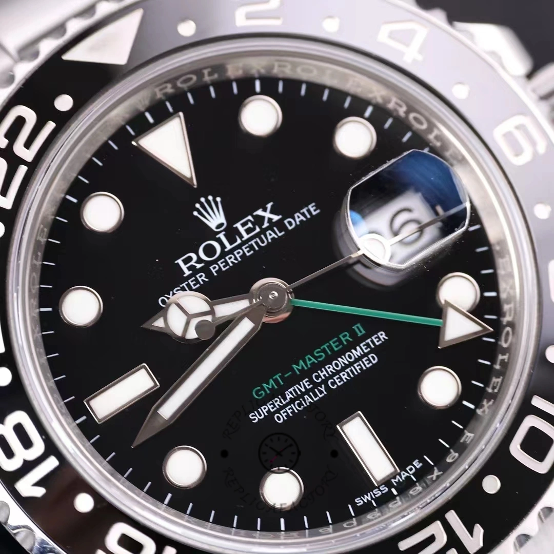 Rolex GMT-Master II 116710LN, dial macro showing markers, GMT hand, and date window.