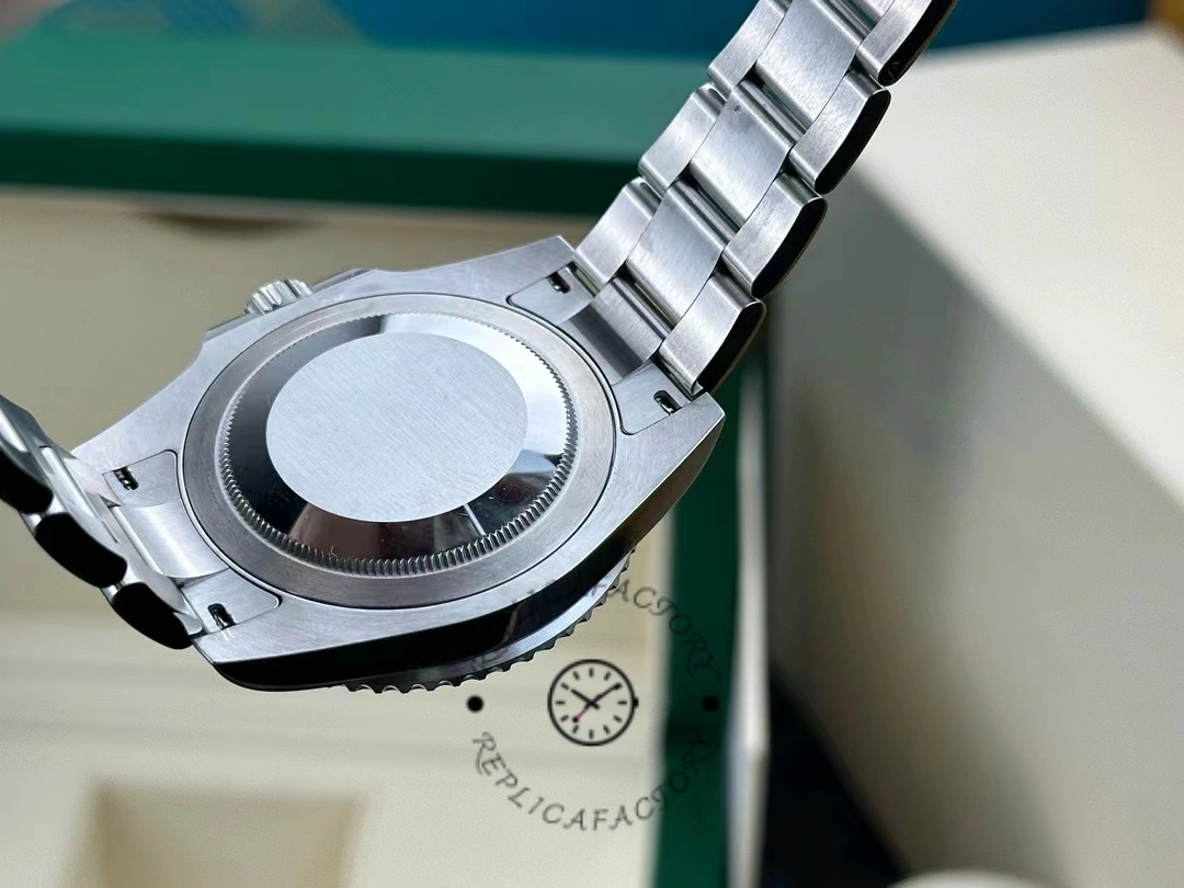 Caseback view of Rolex GMT-Master II 126720VTNR with Oyster bracelet and clasp open.