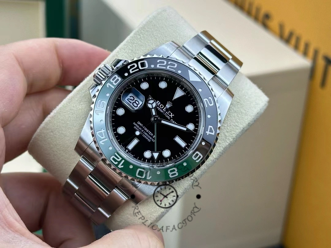 Angled hand-held view of Rolex GMT-Master II 126720VTNR showing case and bezel edge.