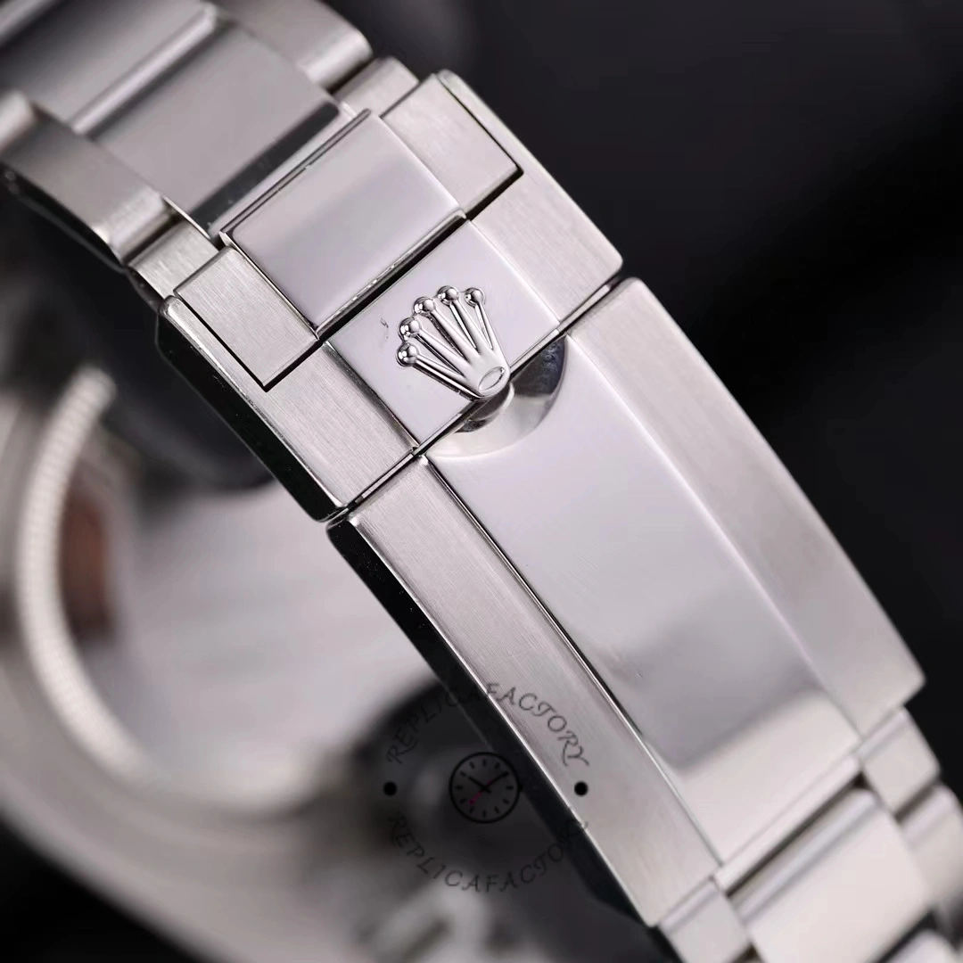 Rolex GMT-Master II 116710LN, clasp close-up showing Rolex crown logo on steel clasp.