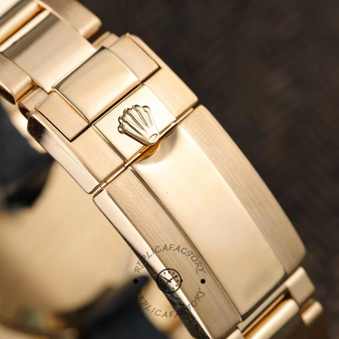 Rolex GMT-Master II 116718LN, clasp close-up showing crown logo on gold bracelet.