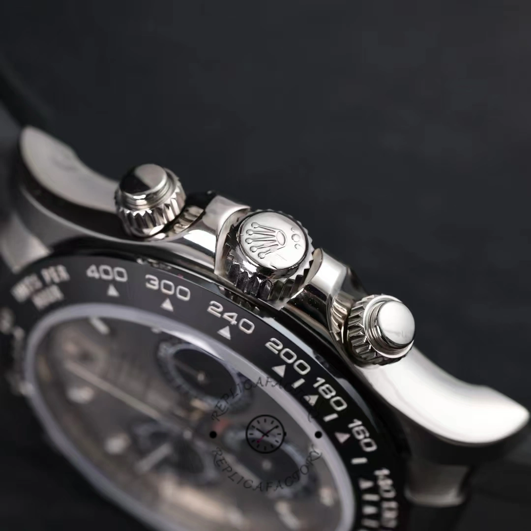 Rolex Daytona 116519 crown and pushers close-up, white gold case side detail.