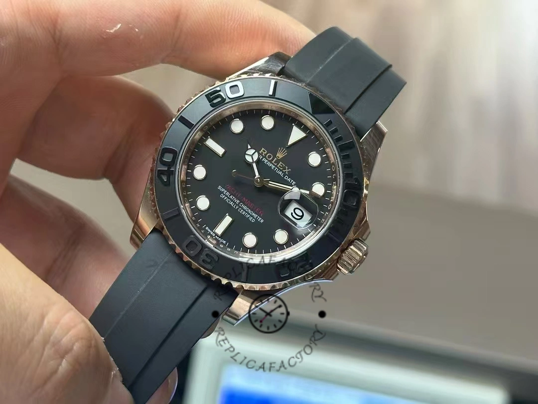 Rolex Yacht-Master 116655, hand-held view showing Everose case and black bezel.