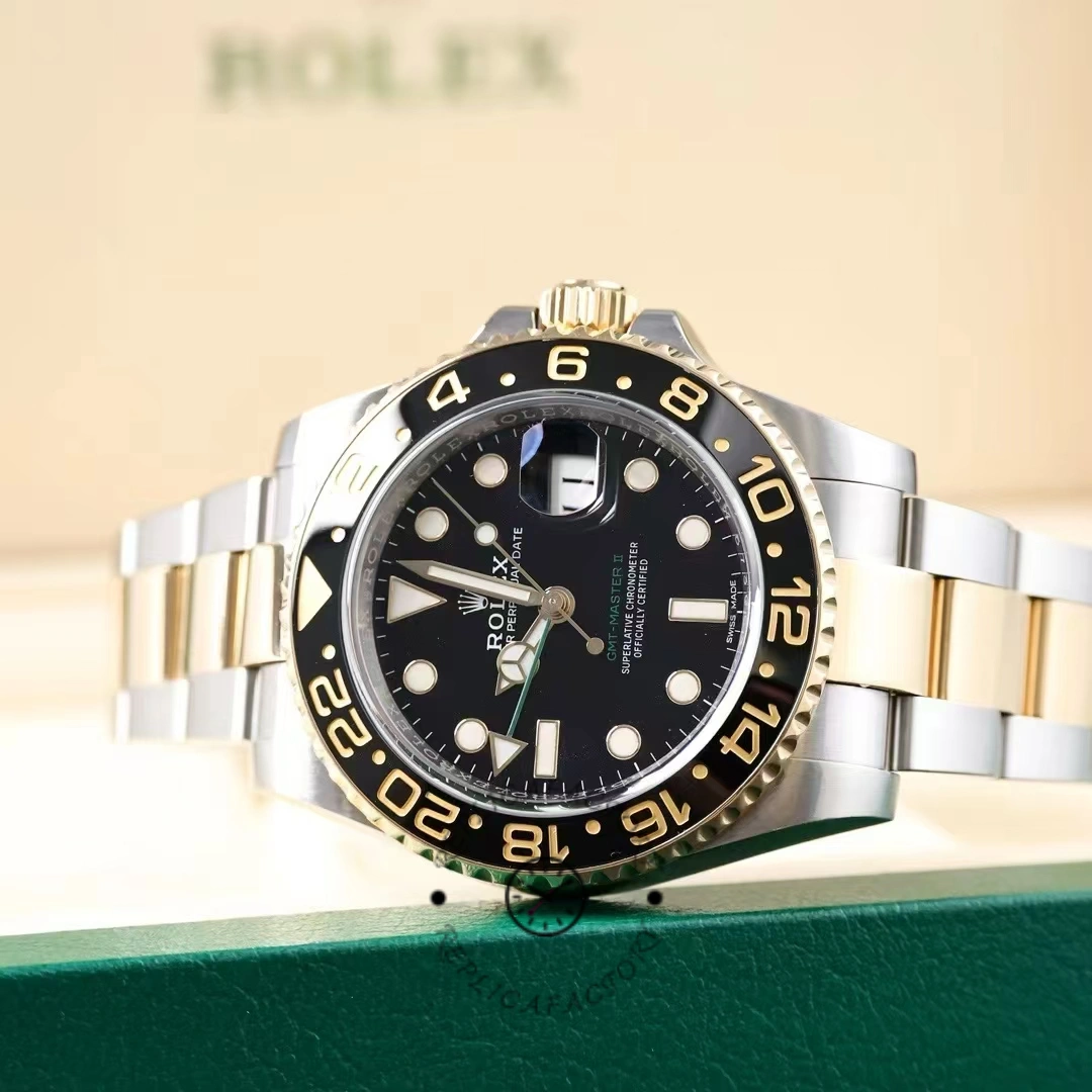 Rolex GMT-Master II 116713LN, black dial with two-tone bracelet and black bezel.