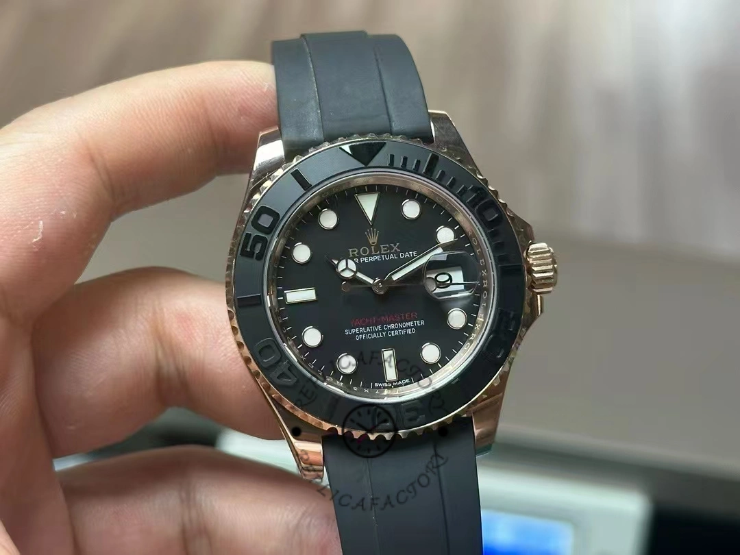Rolex Yacht-Master 116655, hand-held front view showing black dial and bezel scale.
