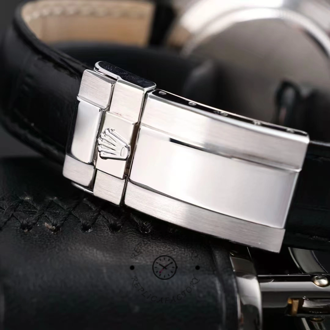 Clasp close-up of Rolex Daytona 116599 showing metal clasp and strap attachment.