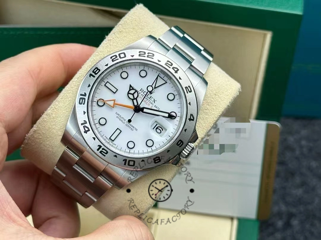 Angled hand shot of the Rolex Explorer II m226570 0001, highlighting case and bezel.