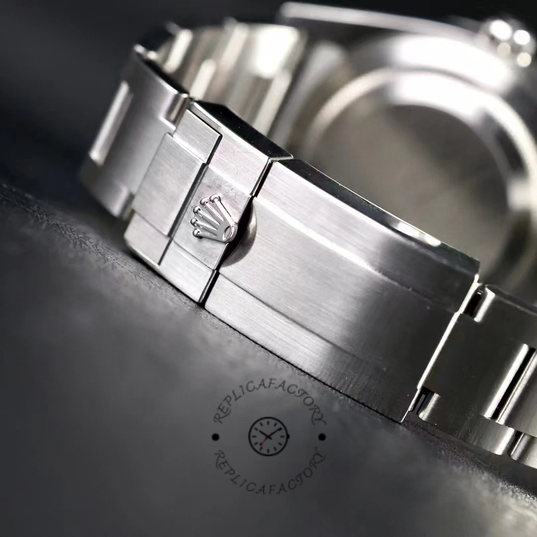 Rolex Explorer 214270 clasp close-up, stainless steel Oyster bracelet clasp detail.