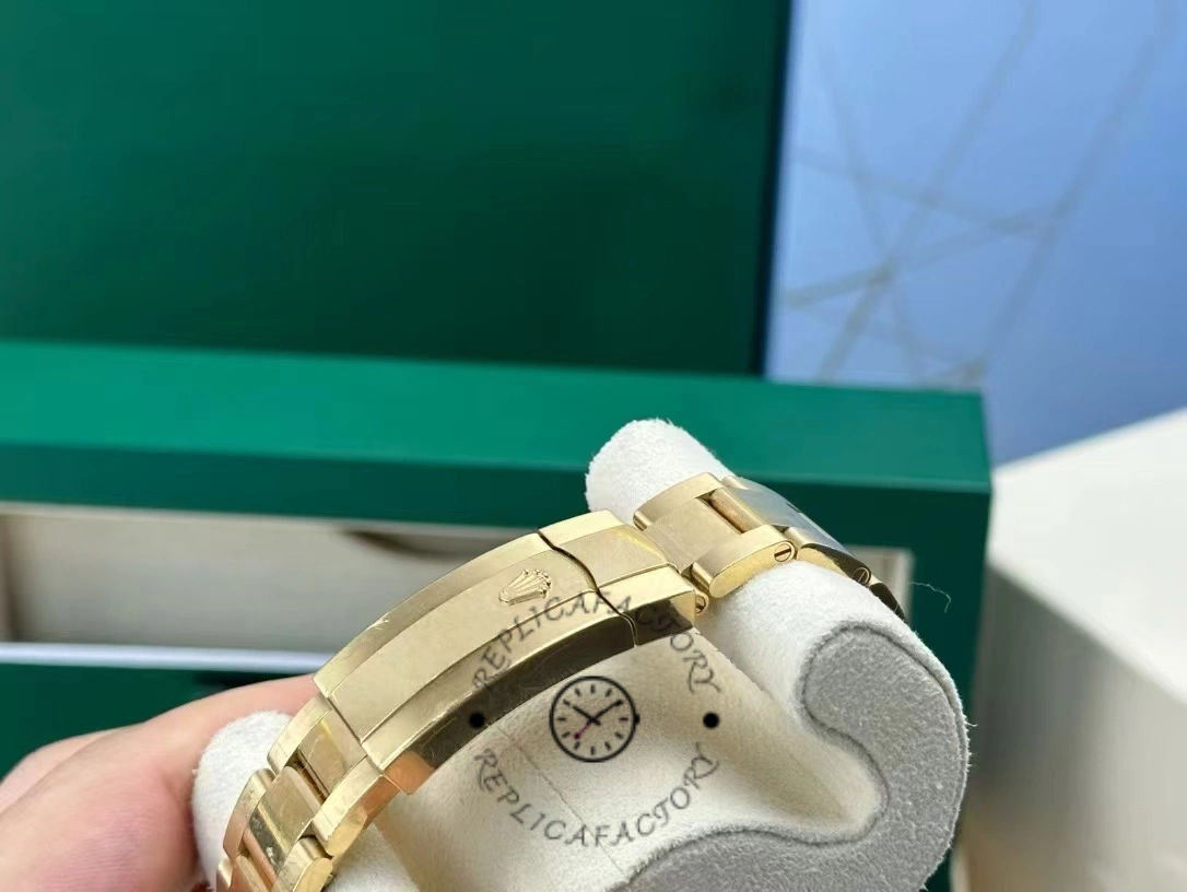 Rolex Sky-Dweller M336938-0002, bracelet and clasp view with gold links and clasp detail.