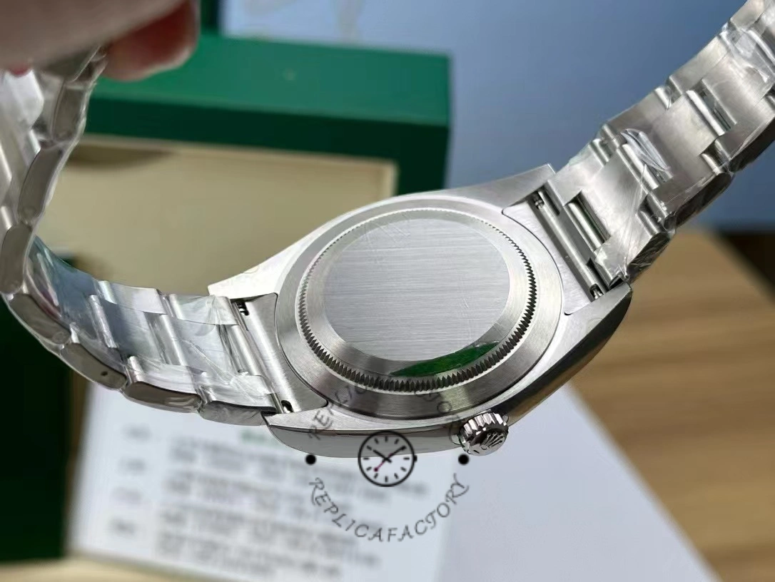 Caseback view of the Rolex Oyster Perpetual 114300 0001 showing solid back and bracelet.