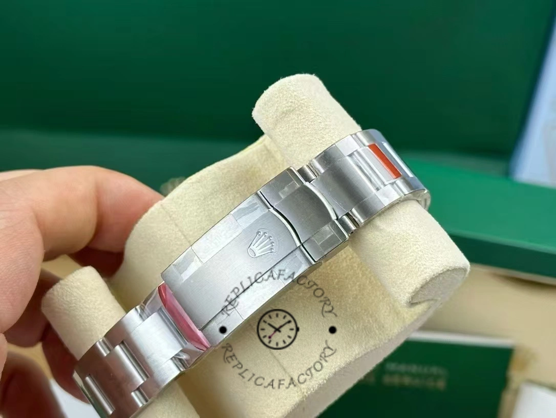 Bracelet clasp view of the Rolex Oyster Perpetual 114300 0001 on cushion, clasp and links shown.