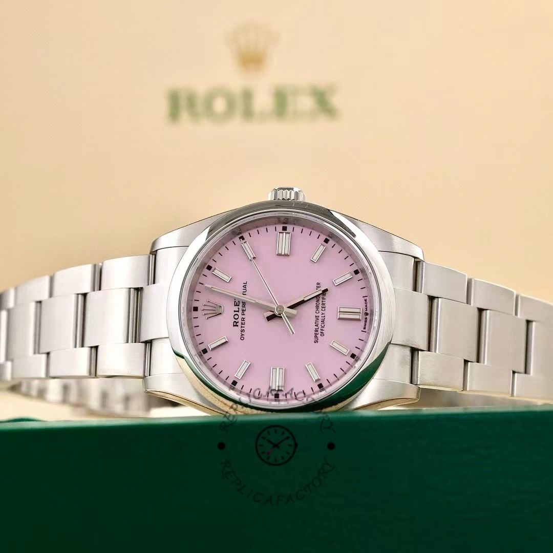 Rolex Oyster Perpetual 126000-0008, pink dial, full watch display with Rolex packaging.