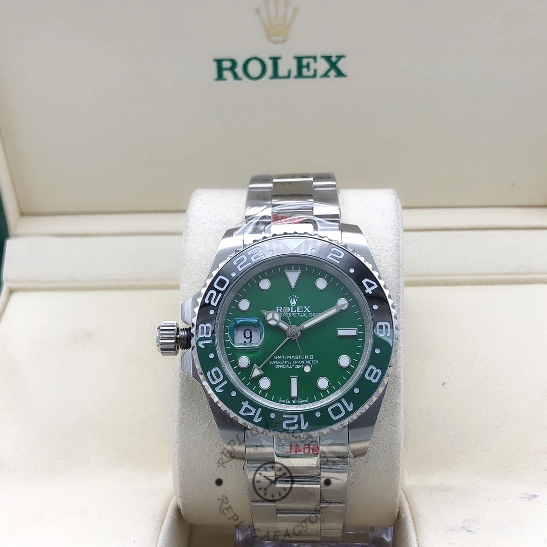 Rolex GMT-Master II m126729VTNR 0001 in Rolex box, green dial, front view on cushion.