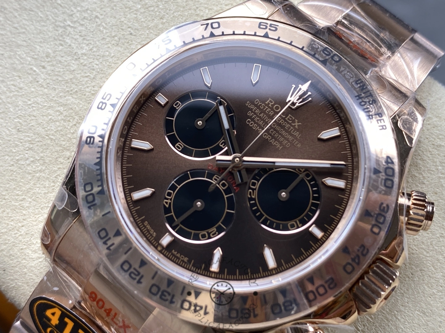 Rolex Daytona m126505 0003, angled dial close-up highlighting bezel and pushers.