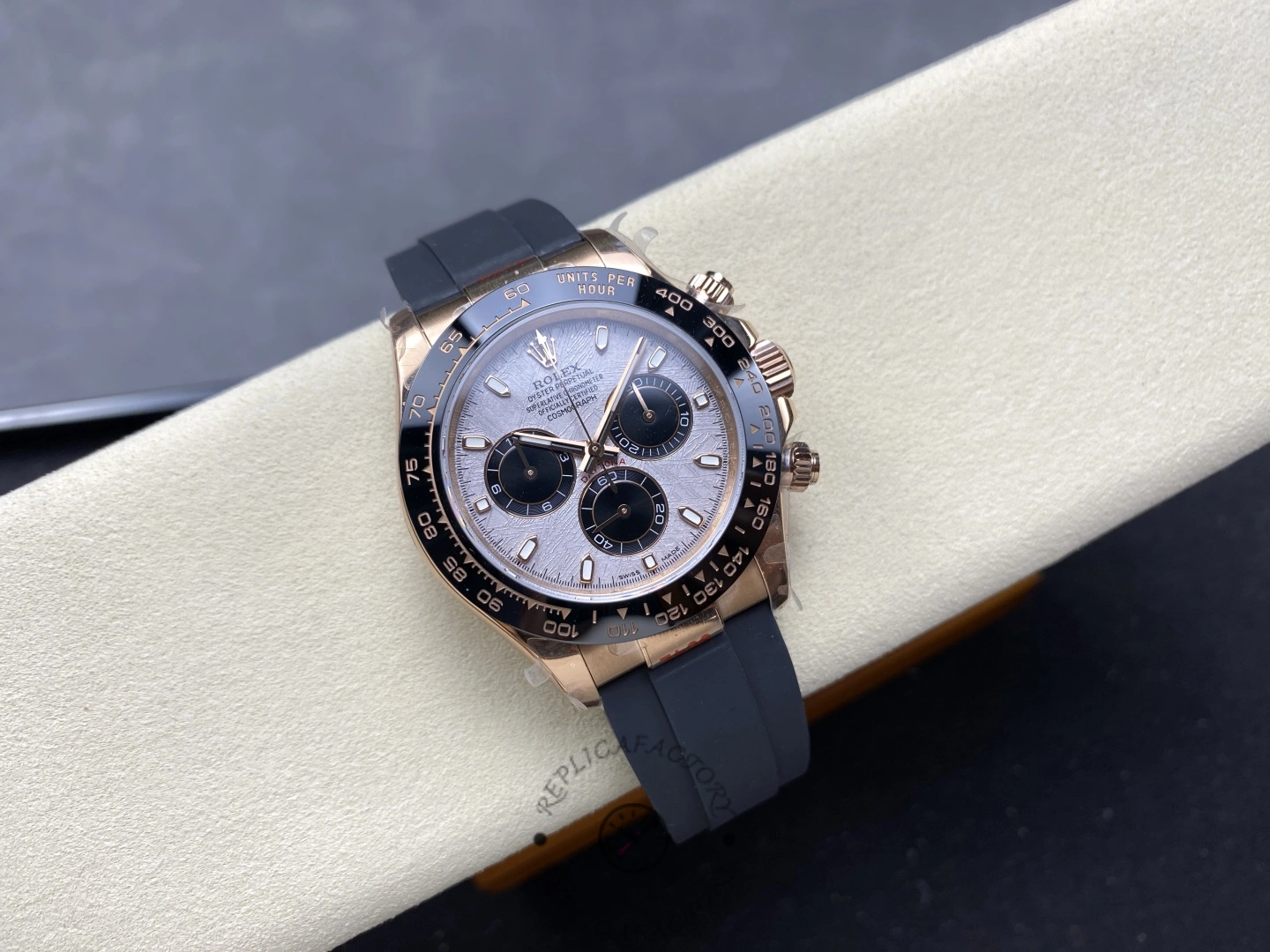 Rolex Daytona 126515LN-0008, full watch view on cushion with black Oysterflex strap.