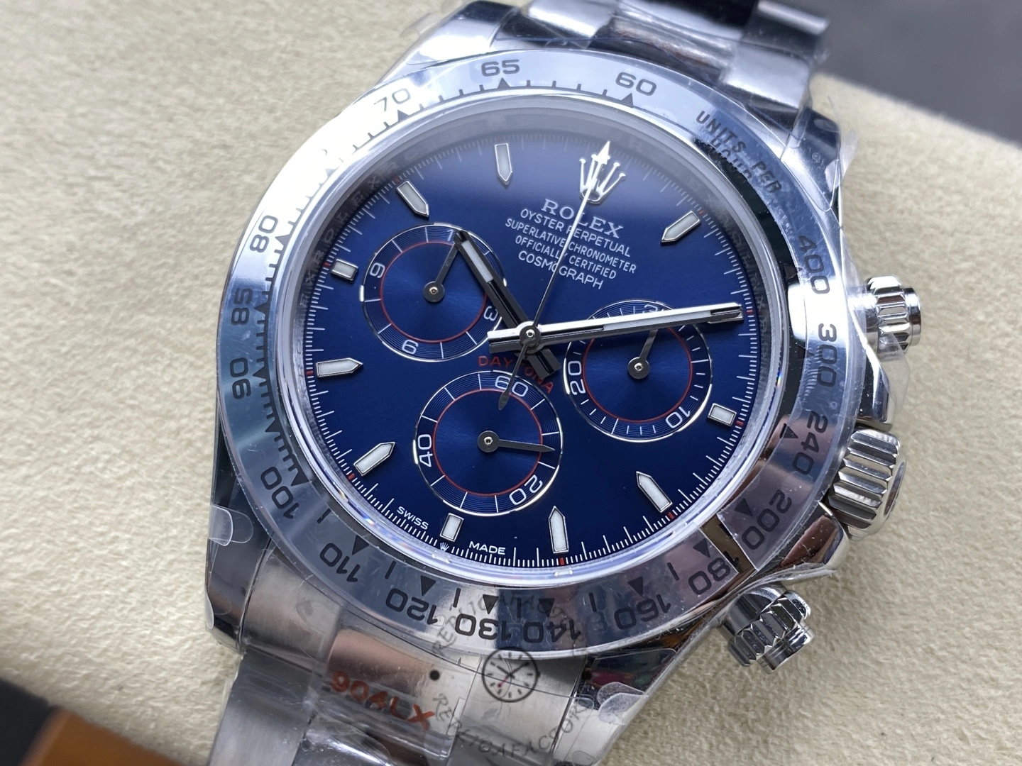 Rolex Daytona m126509-0005, blue dial, side angle showing bezel edge.
