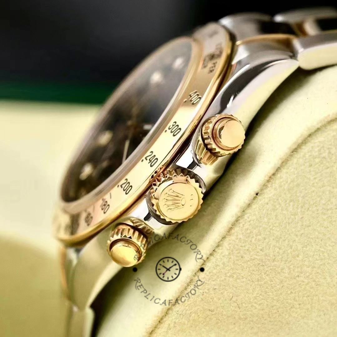 Rolex Daytona 116523 side close-up, yellow gold crown and chronograph pushers.