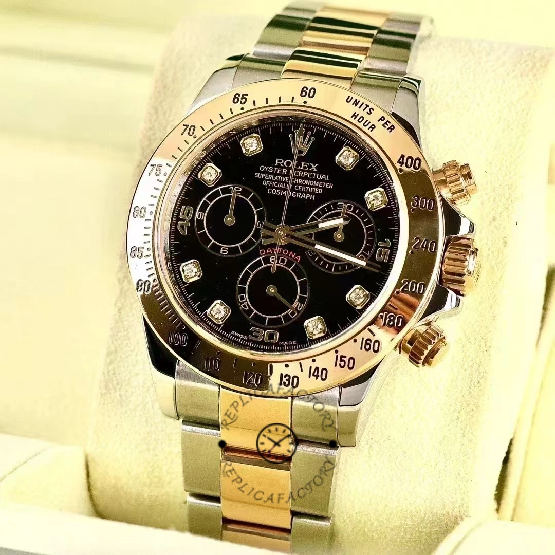 Rolex Daytona 116523 angled view on stand, black diamond dial and gold bezel.