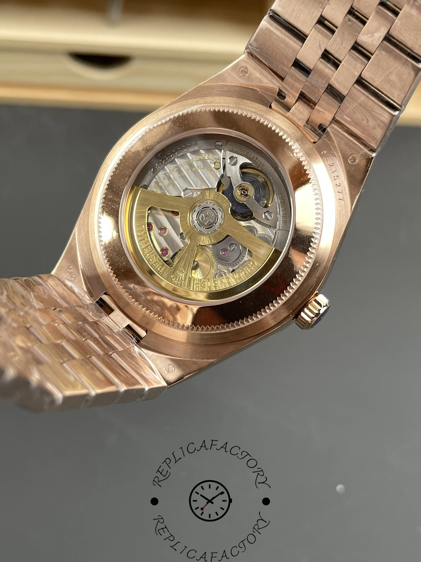 Transparent caseback view of Rolex Land-Dweller M127235-0001 Replica revealing automatic movement and rotor.