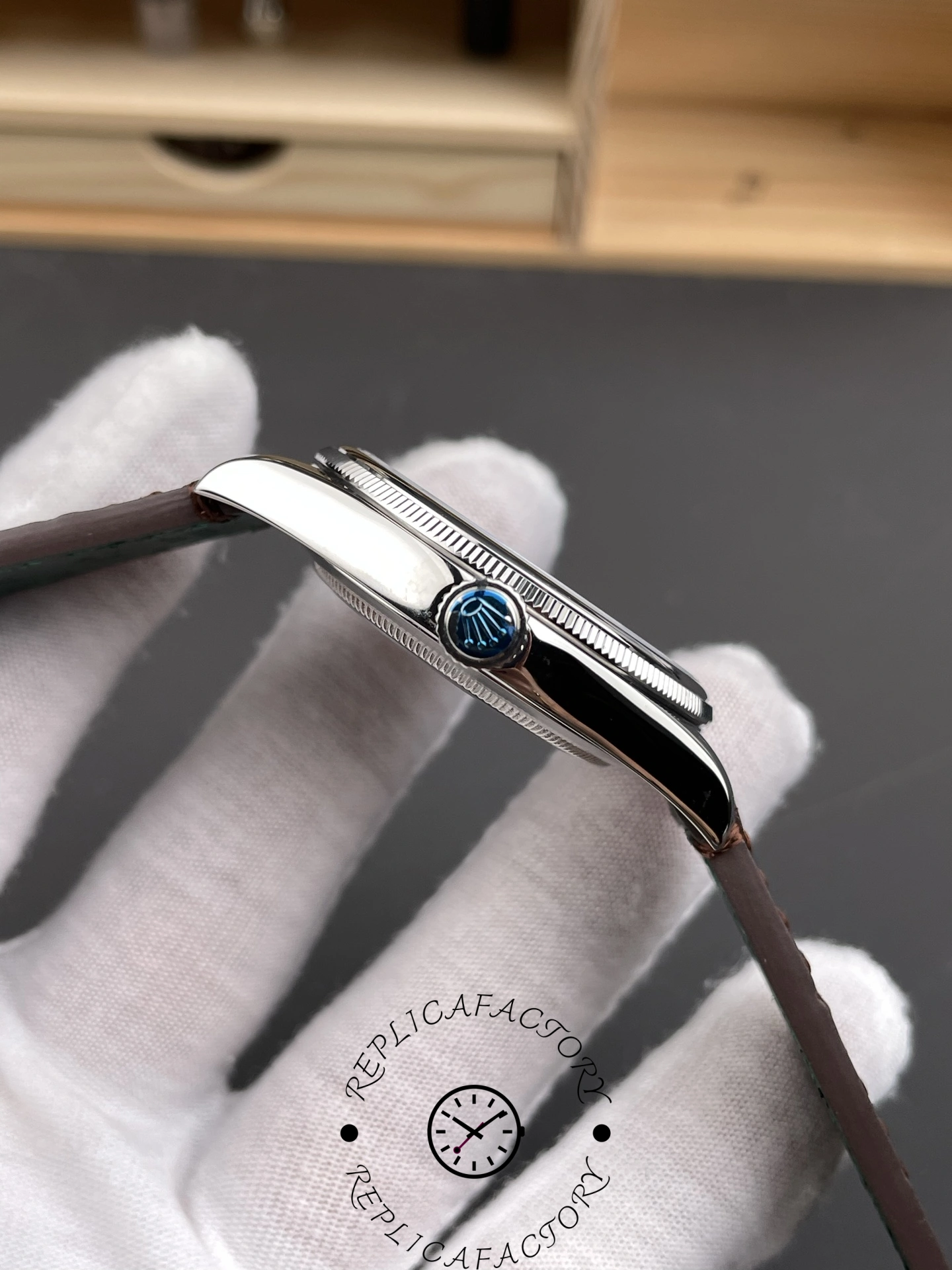 Crown-side view of the Rolex 1908 52506-0002 with polished case flank and signed crown.