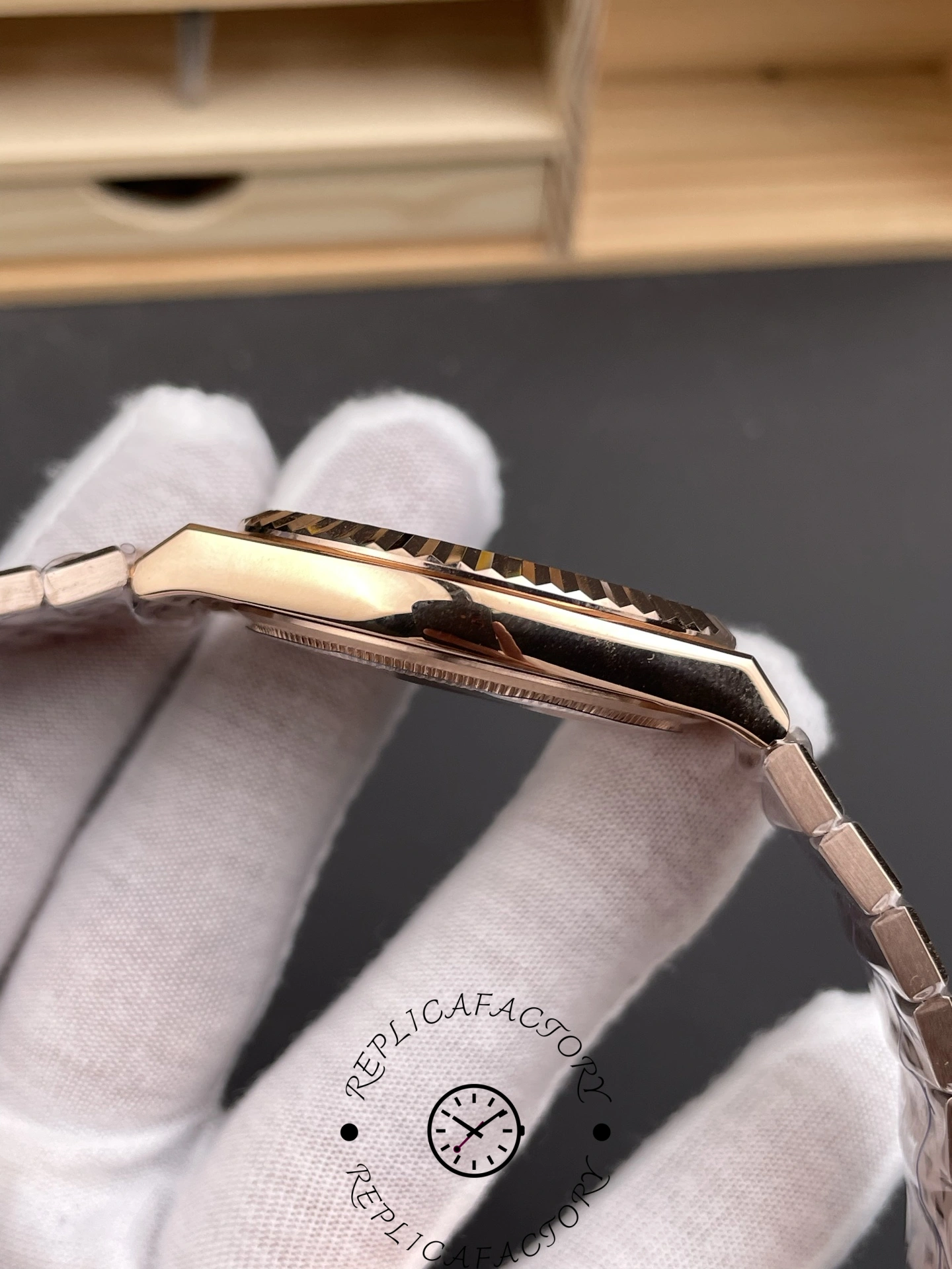 Side angle of Rolex Land-Dweller M127235-0001 Replica highlighting polished rose gold lugs and case side.