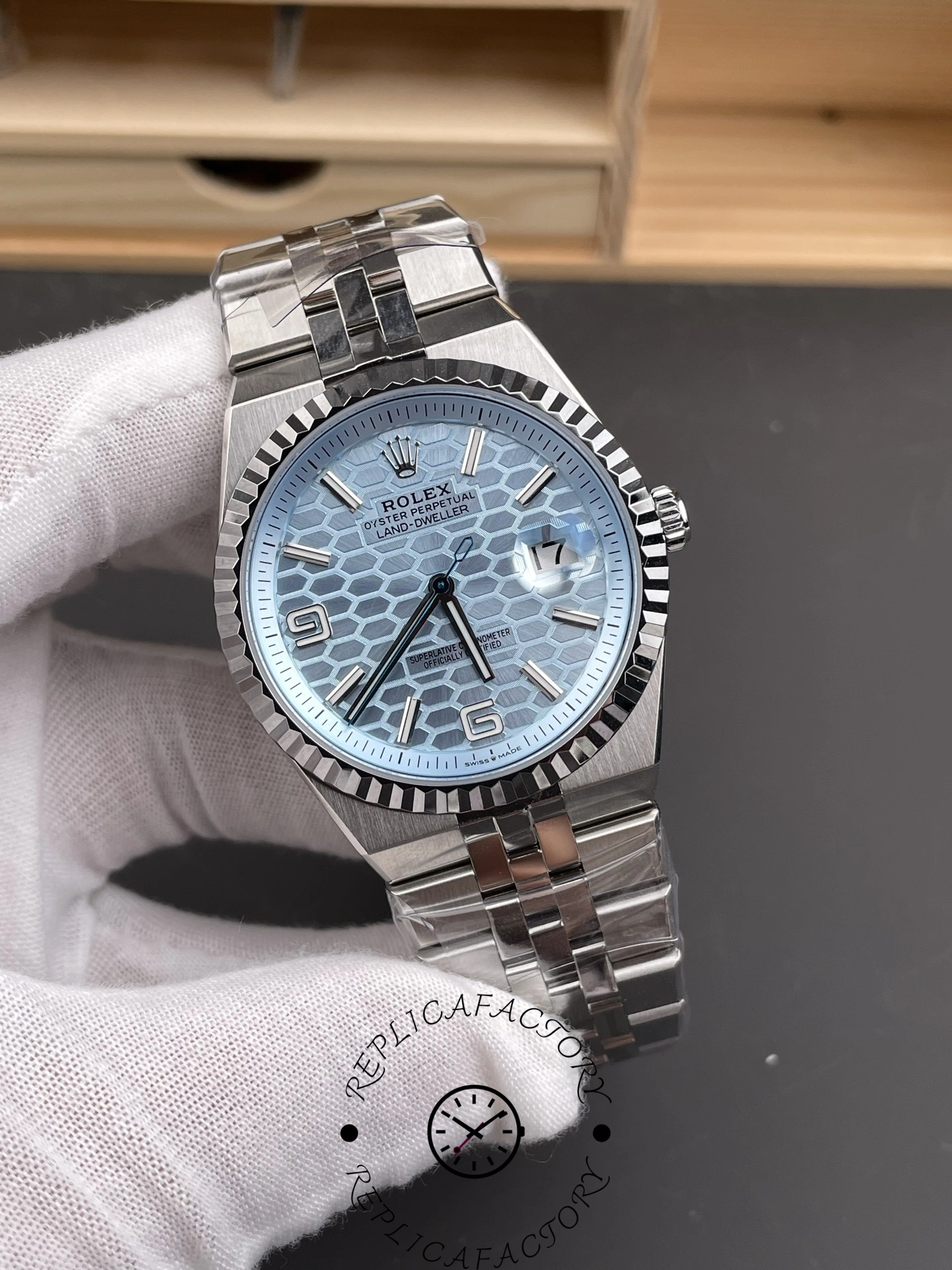 Angled front view of Rolex Land-Dweller 40 127336-0001 Replica with Roman numerals and polished case finish.