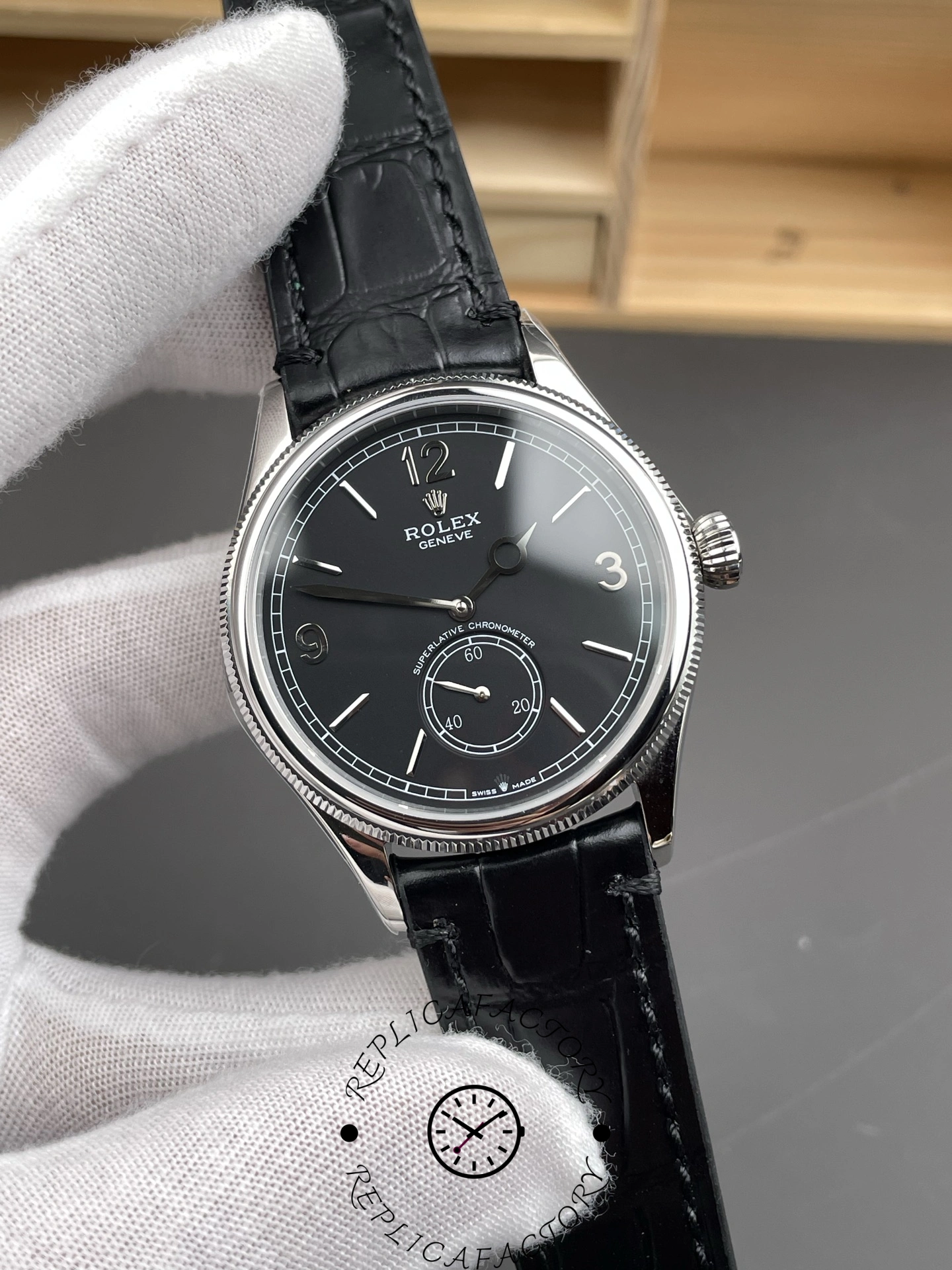 Angled front view of Rolex 1908 Black Dial 52509-0002 39mm replica showing domed crystal and polished case.