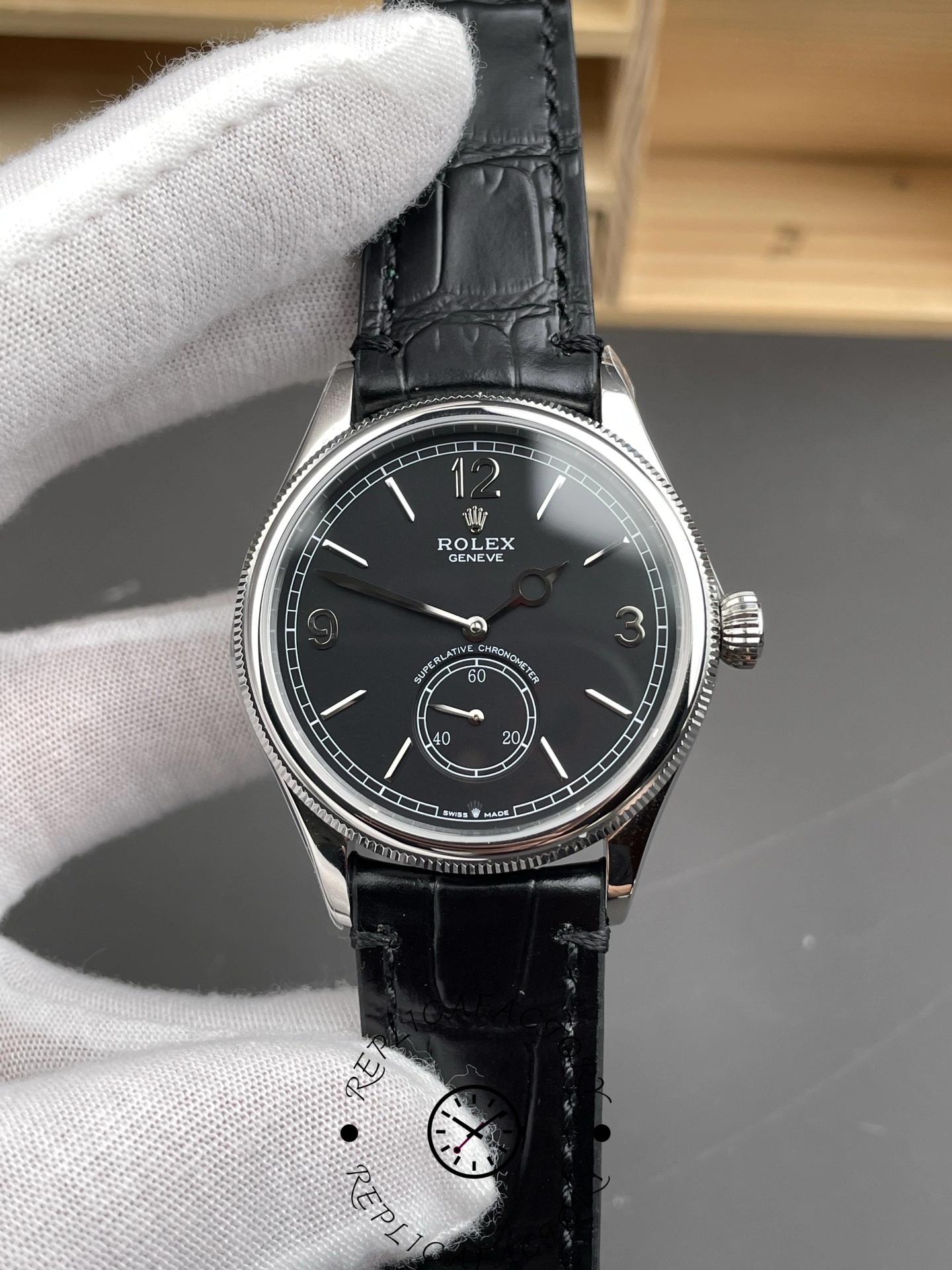 Another front view of Rolex 1908 Black Dial 52509-0002 39mm replica held with white gloves.