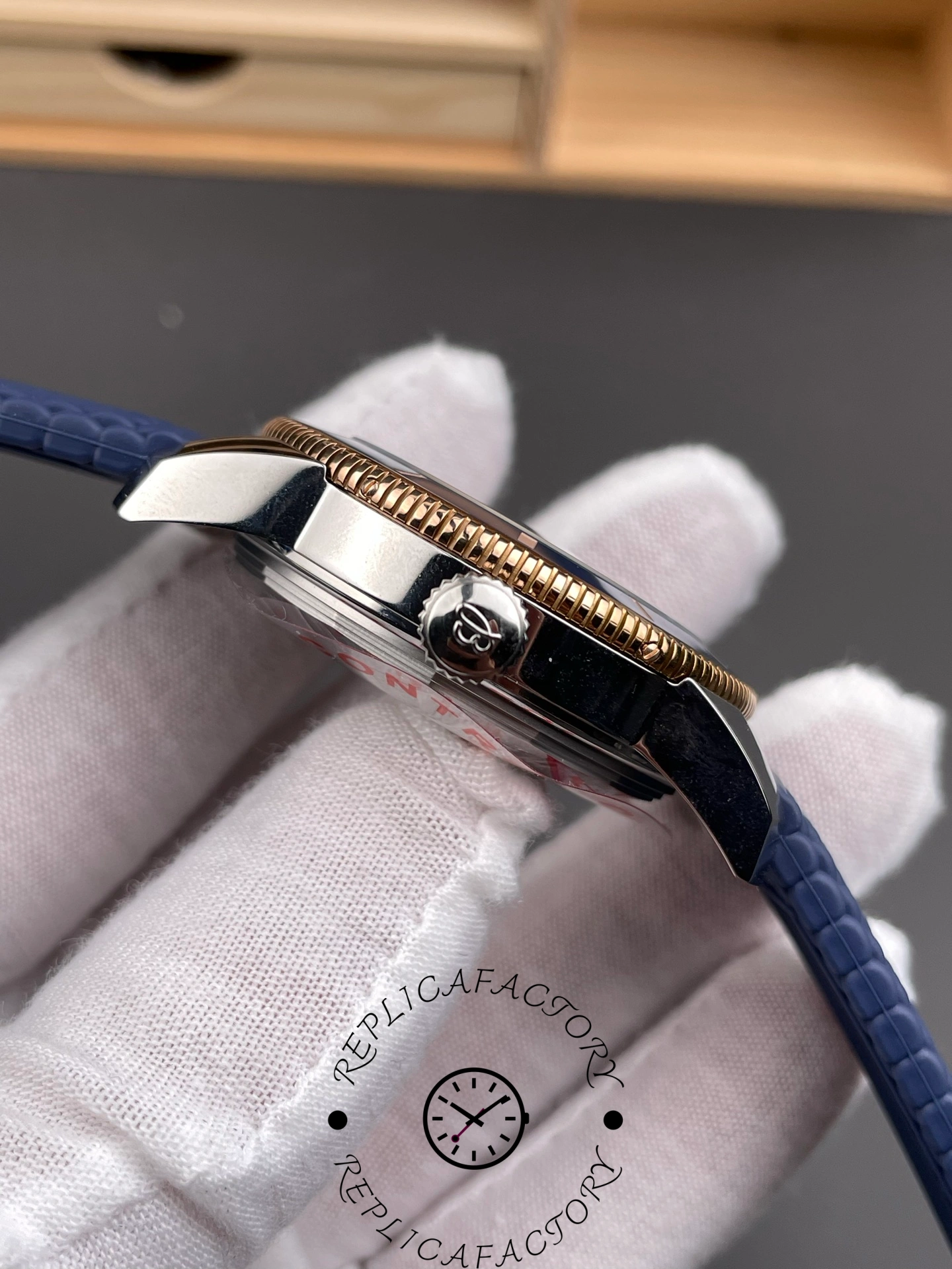 Breitling UB3112161C1S1, side view highlighting crown and strap connection.