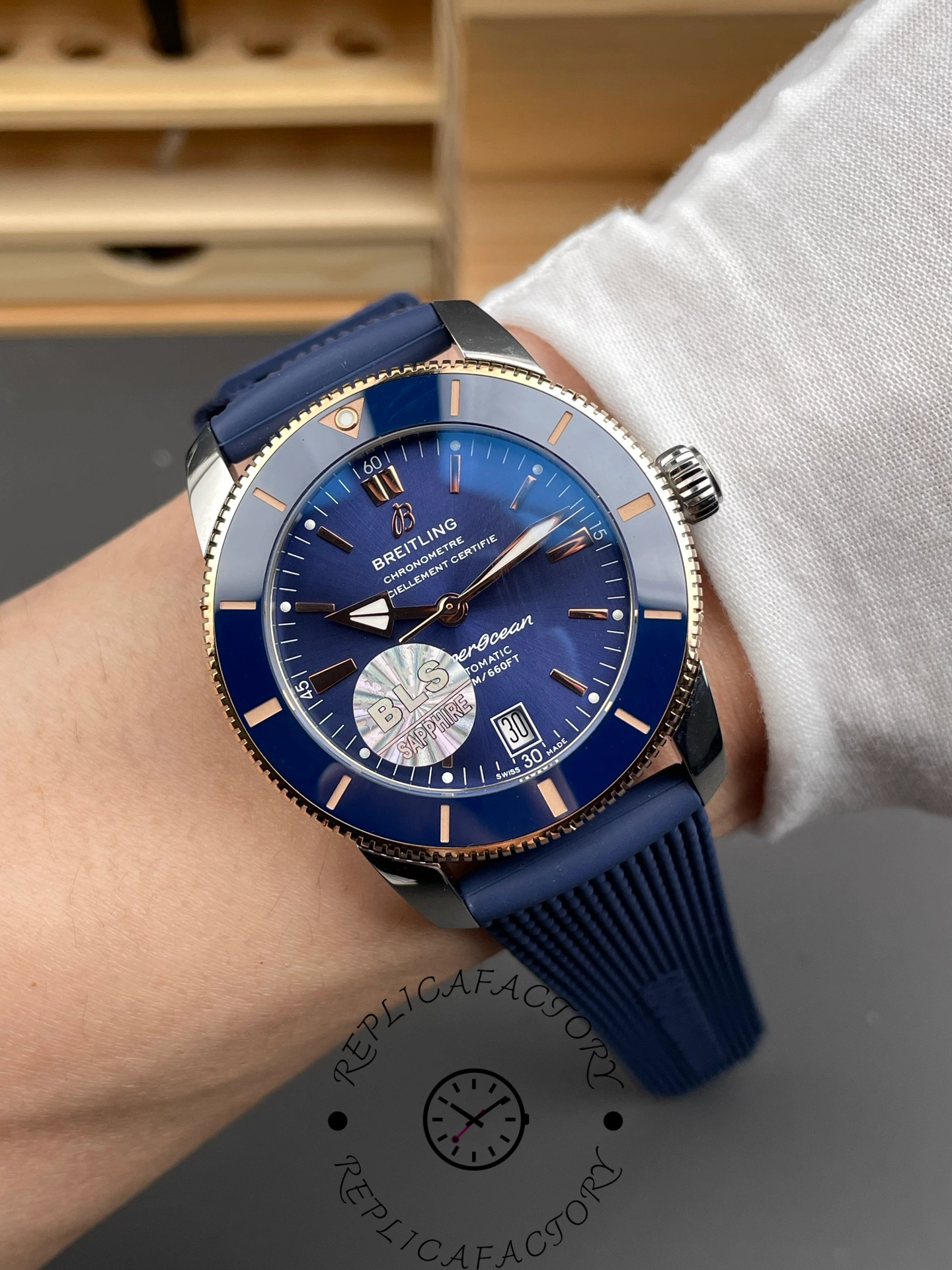 Breitling UB3112161C1S1, wrist shot showing fit and profile with blue rubber strap.