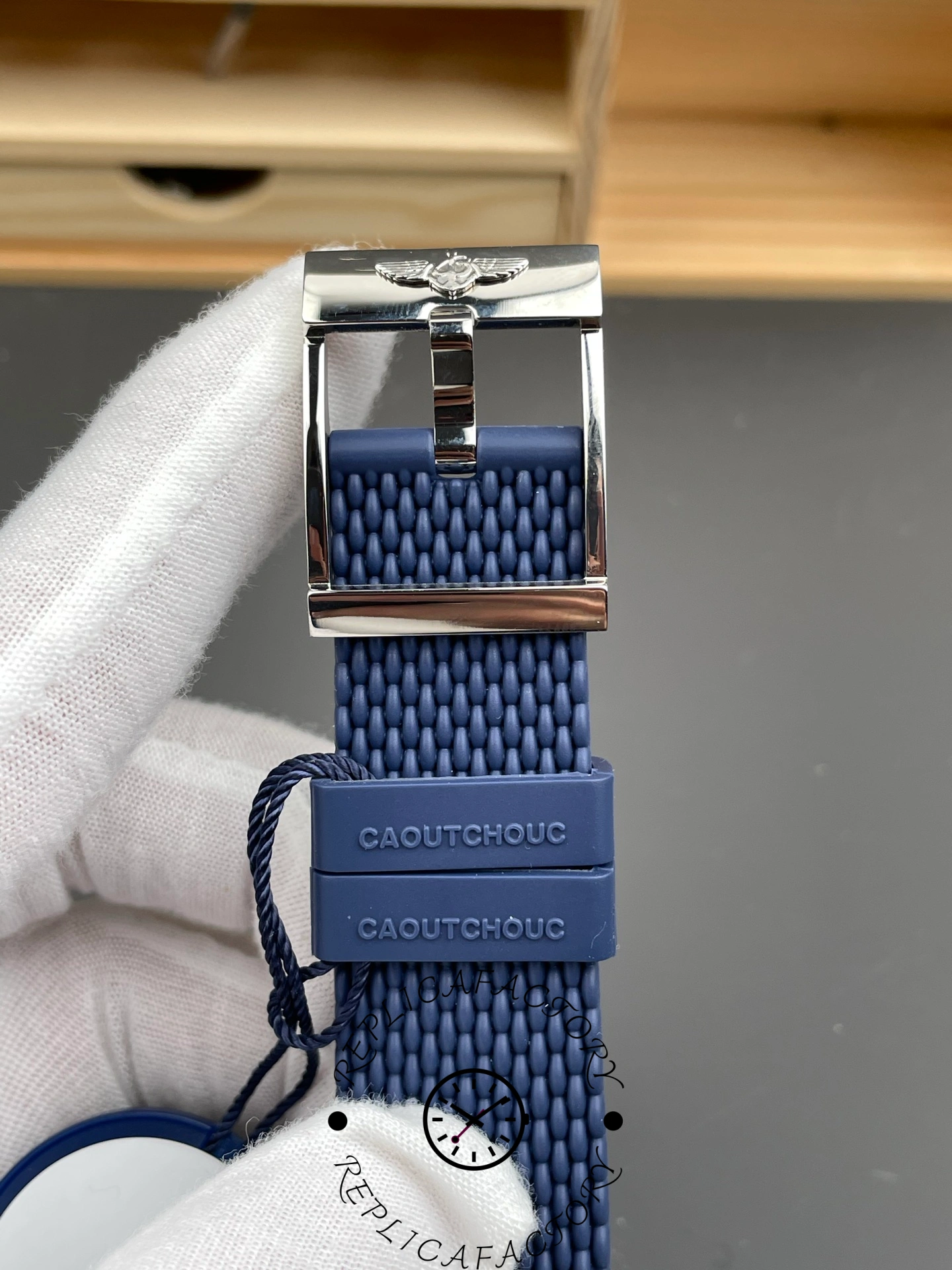 Breitling UB3112161C1S1, buckle and strap end detail showing hardware finish and keeper.