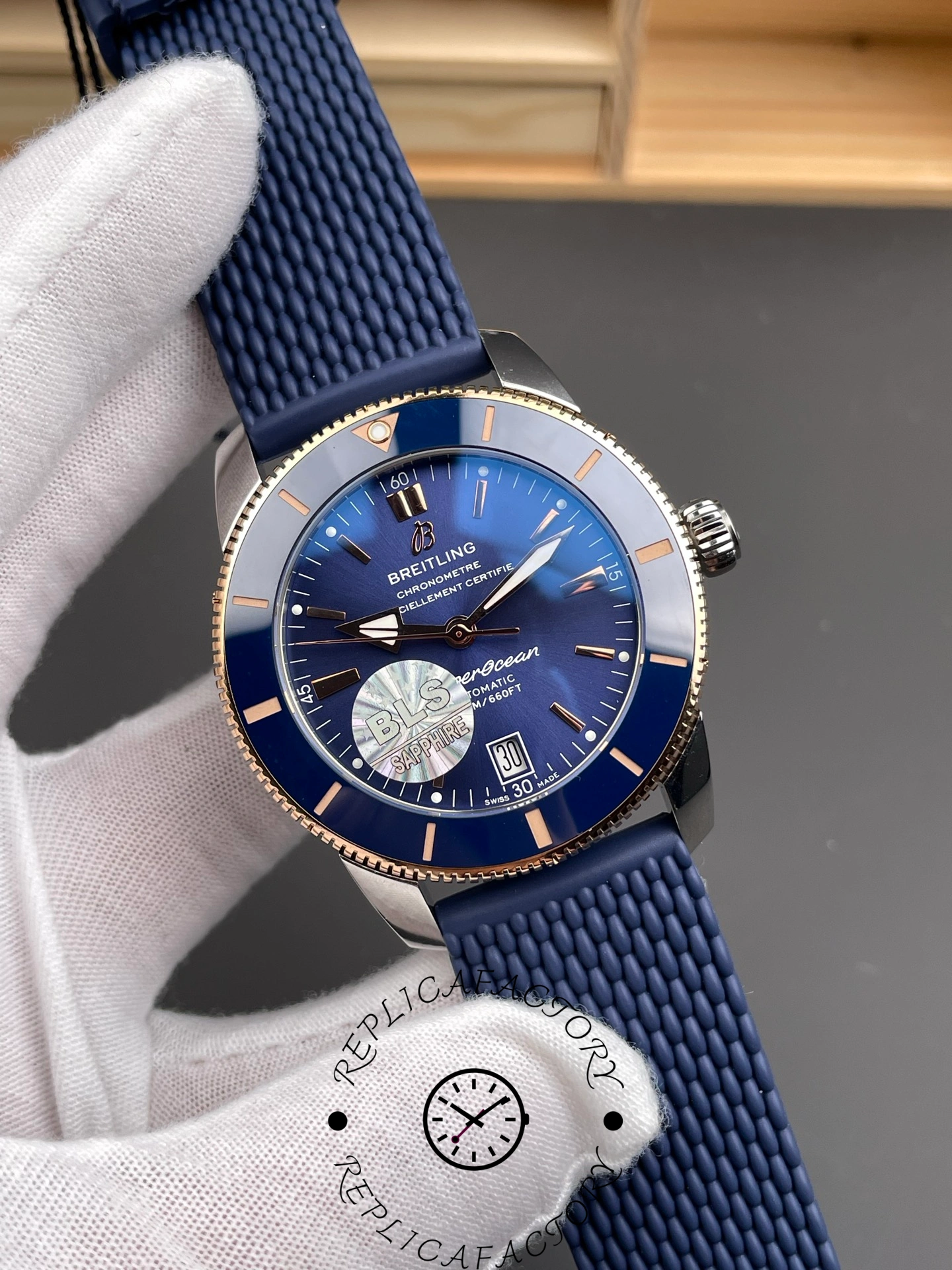 Breitling UB3112161C1S1, close-up on bezel and dial printing, with crisp minute track.